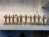 Set of 10 small, antique-finish brass Dashavatara idols of Lord Vishnu's avatars, including Matsya, Kurma, and Rama, used for Hindu pooja altar.